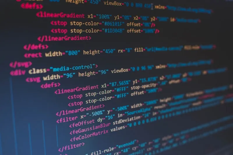 Source code illuminated on a glowing display