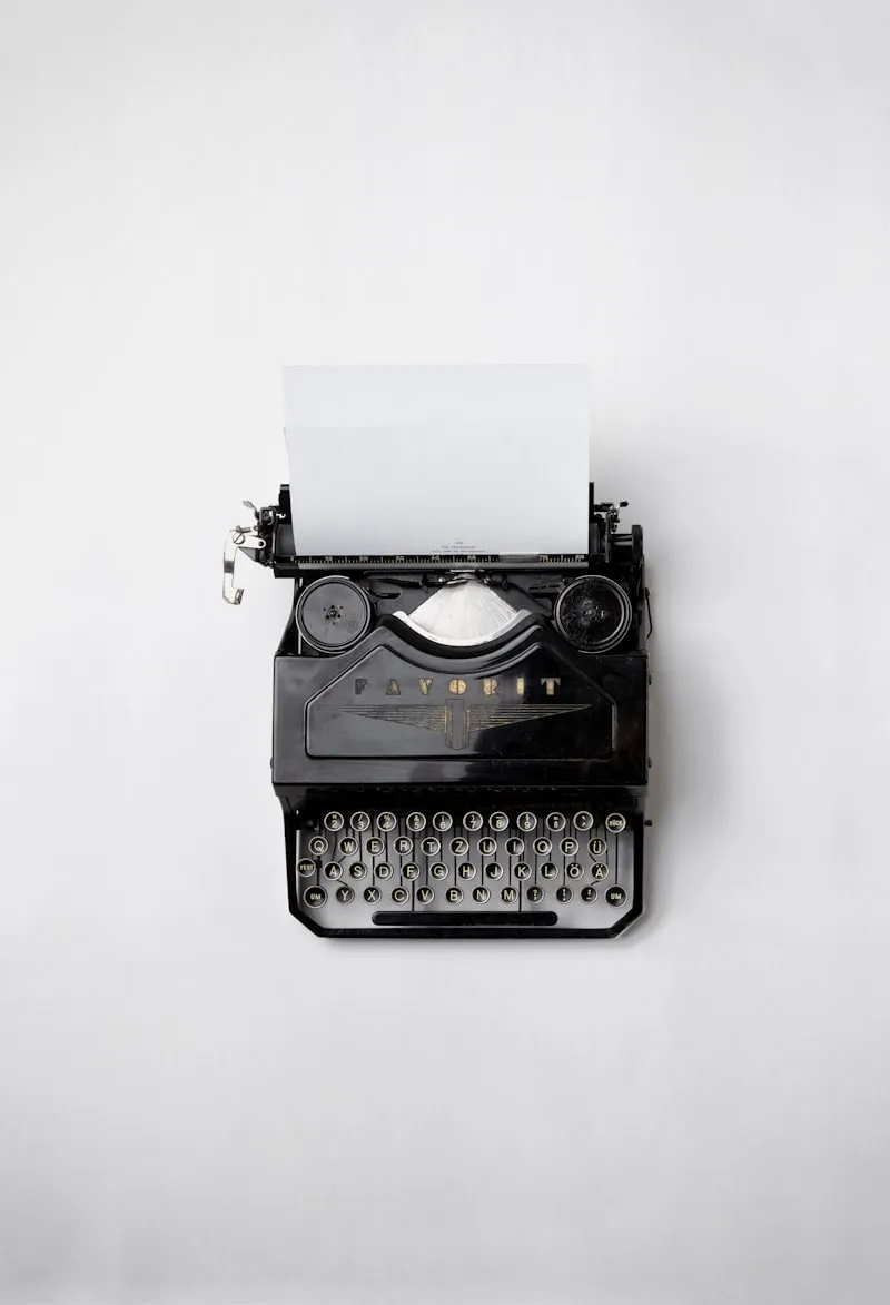 Vintage typewriter with typed page on a wooden desk